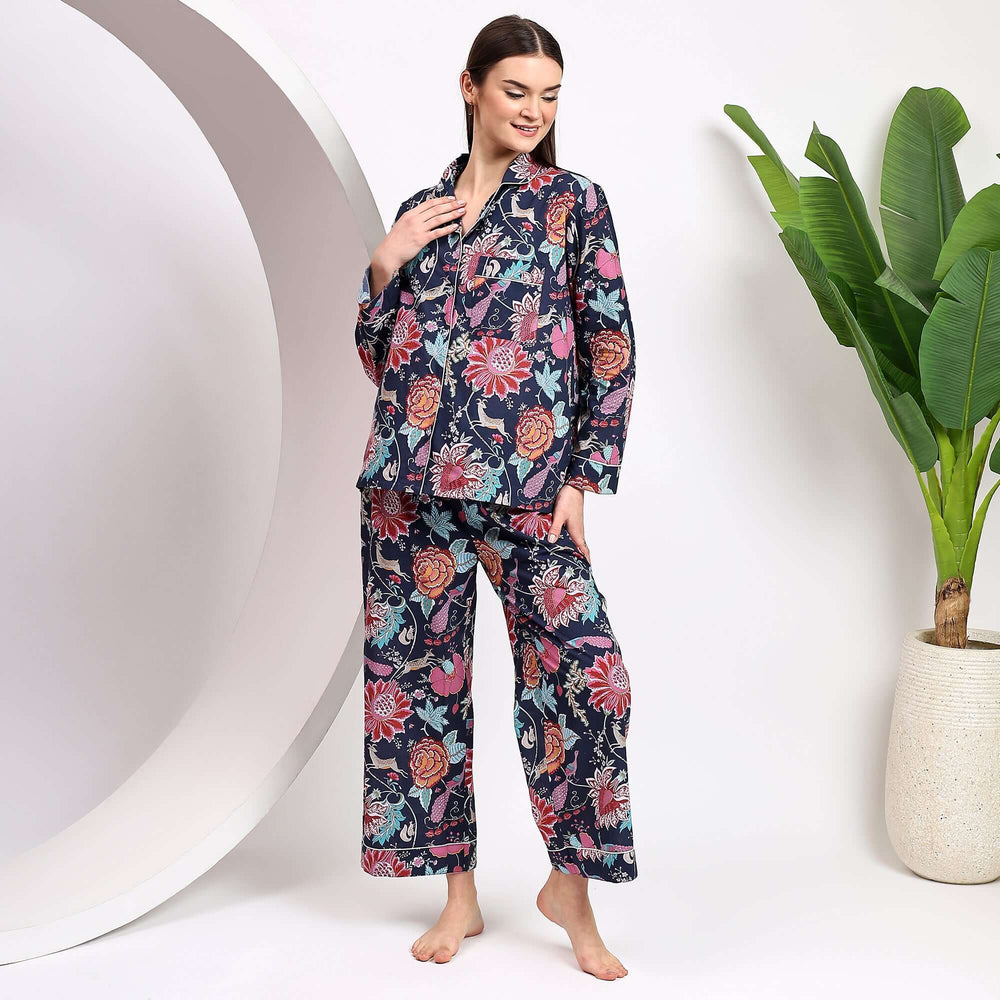 floral print cotton pajamas for women displayed by a model, featuring colorful floral patterns and comfortable design.
