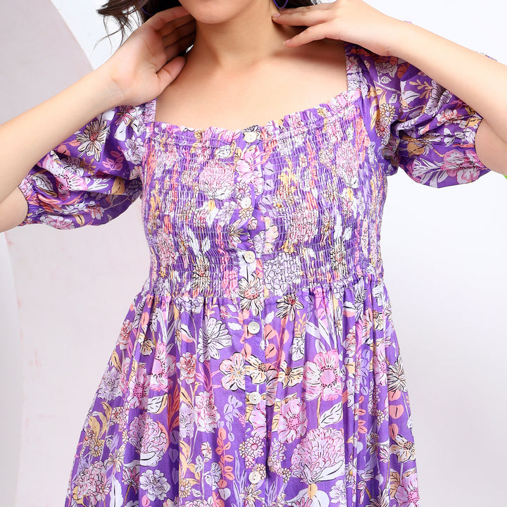 Details of purple midi dress with puff sleeves, fitted waist, and button closure