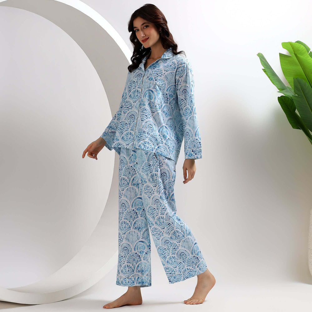 indian block print pajama set for women in blue with intricate designs worn by a model