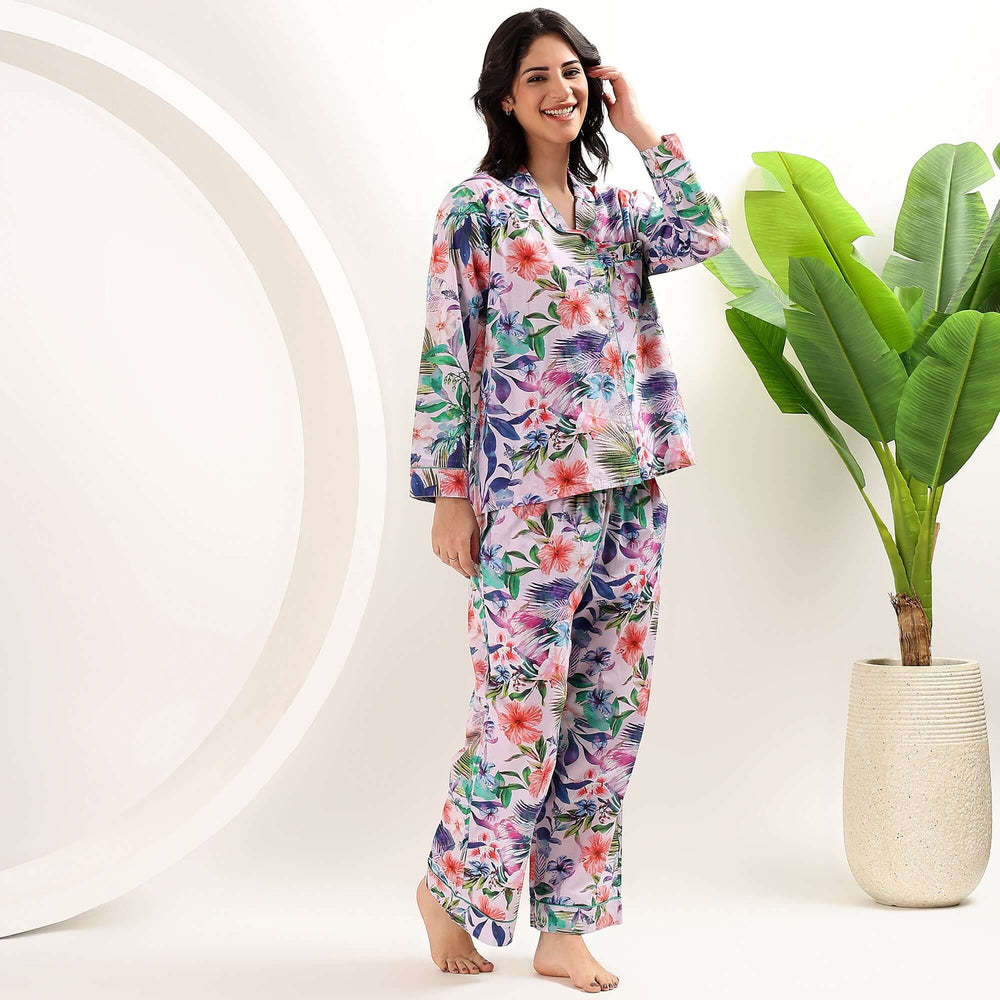 Model wearing tropical print cotton pajama set for women, showcasing vibrant patterns in a comfortable fit.