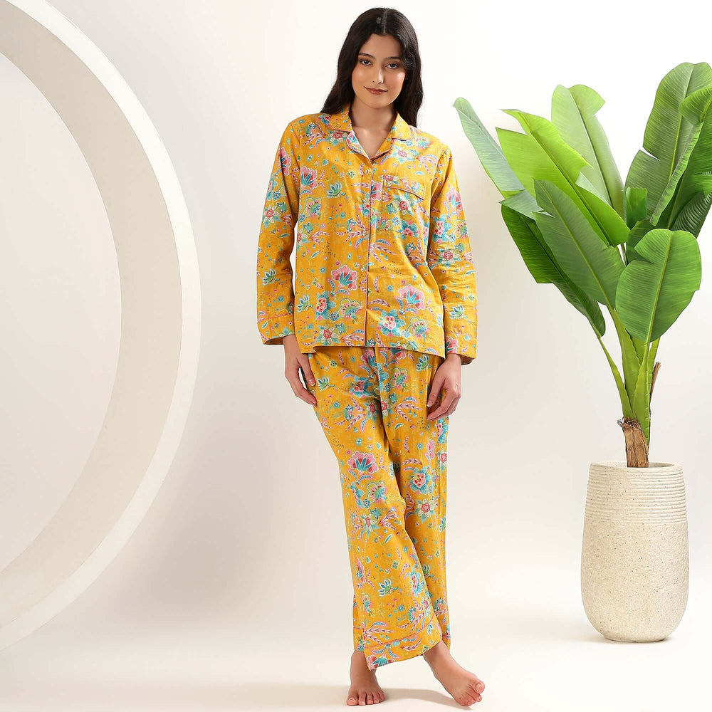 Model wearing Block Print Floral Indian Cotton PJs for Women in a vibrant yellow floral design.