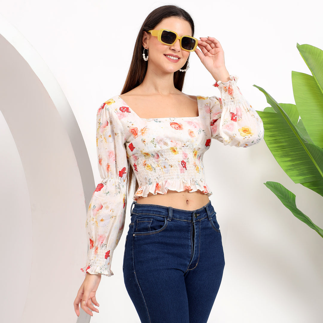 Cropped floral top paired with jeans, perfect for casual outings