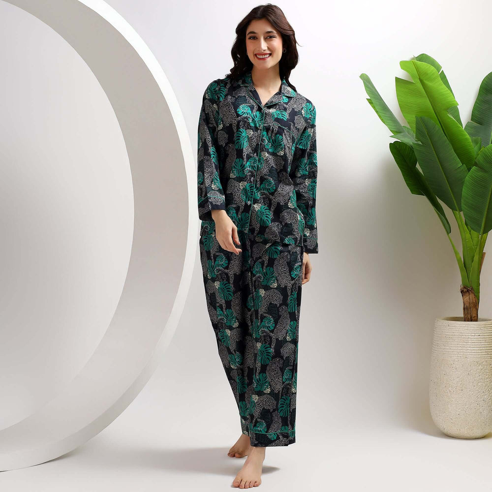 A woman wearing leopard print pajamas for women, showcasing comfort and style in a chic design.