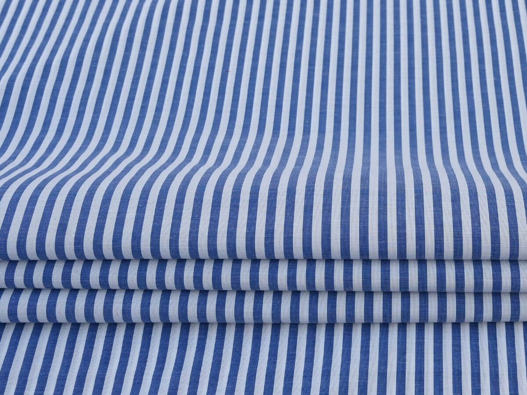 Online Fabrics by Yard Store Indian Cotton Stripe Fabric in blue and white for sewing and crafting projects.