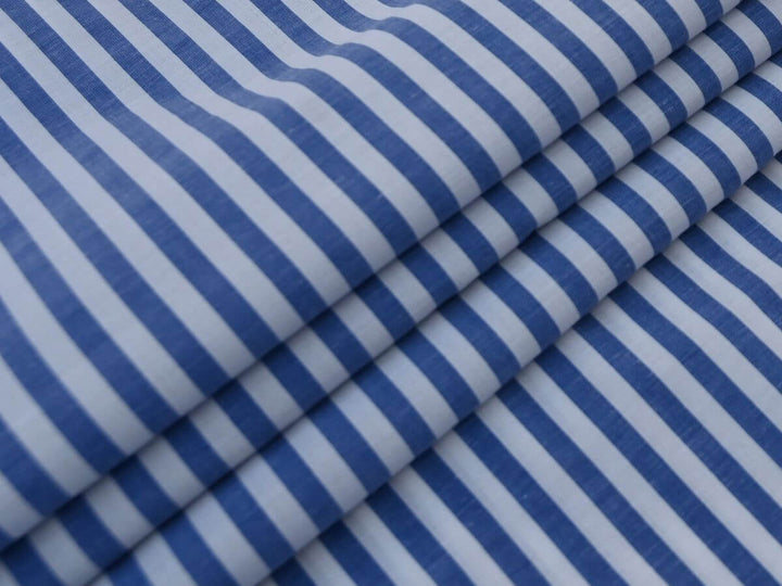 Indian Cotton Stripe Fabric featuring blue and white stripes folded elegantly.