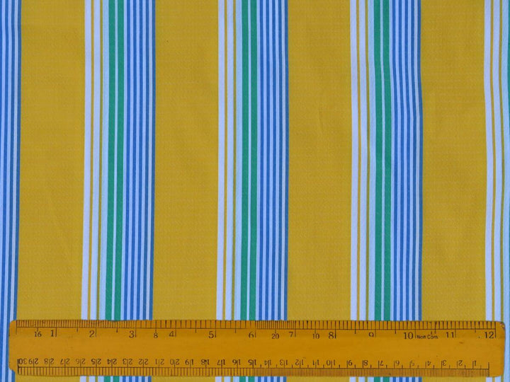 Stripe By the Yard Fabric featuring vibrant yellow and blue stripes with a ruler for scale.