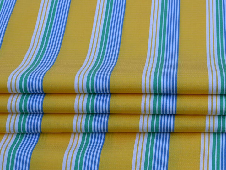 Stripe By the Yard Fabric with vibrant yellow, green, and blue stripes, ideal for sewing projects and crafts.