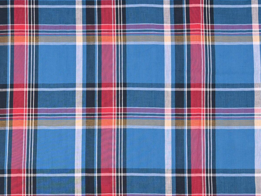 woven plaid tartan fabric by the yard in vibrant blue and red hues, ideal for sewing projects.