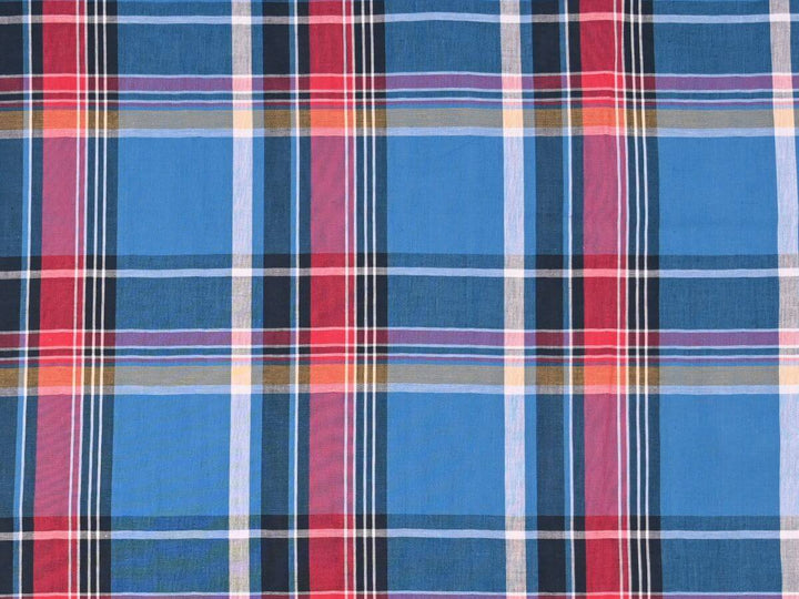 woven plaid tartan fabric by the yard in vibrant blue and red hues, ideal for sewing projects.
