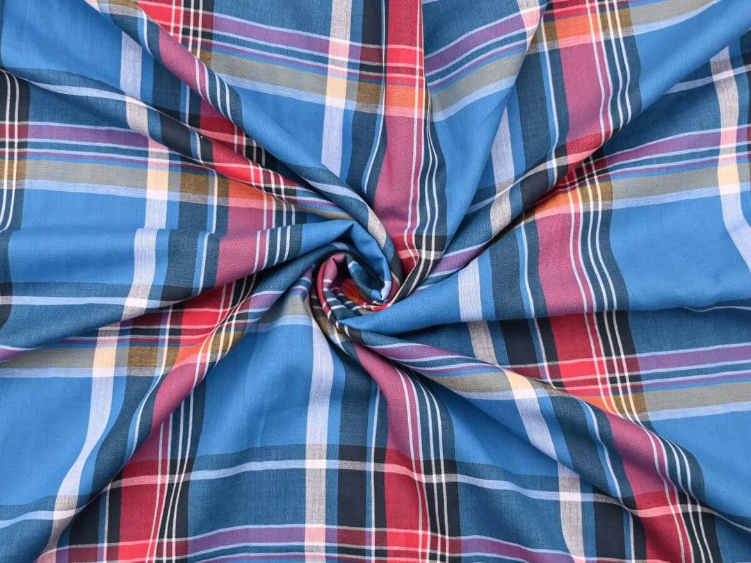 woven plaid tartan fabric by the yard in vibrant blue, red, and yellow colors, ideal for sewing and quilting projects.