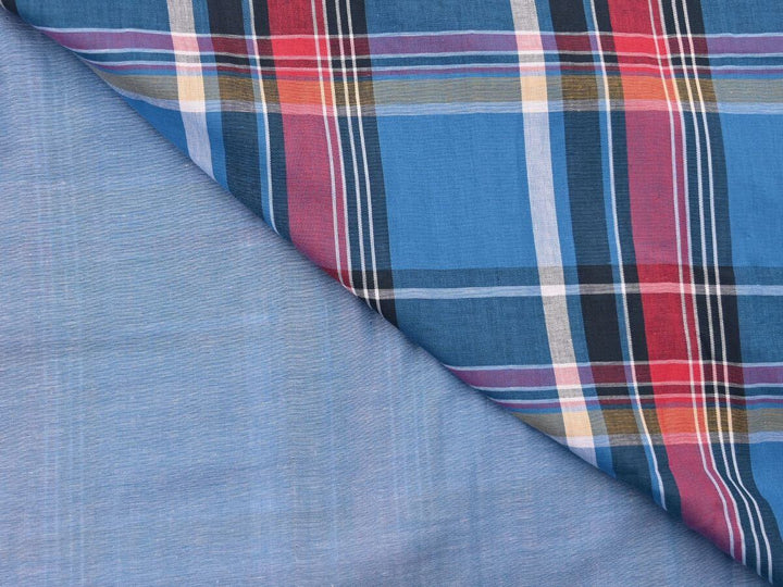 woven plaid tartan fabric by the yard, showcasing vibrant colors and classic patterns, ideal for sewing projects.