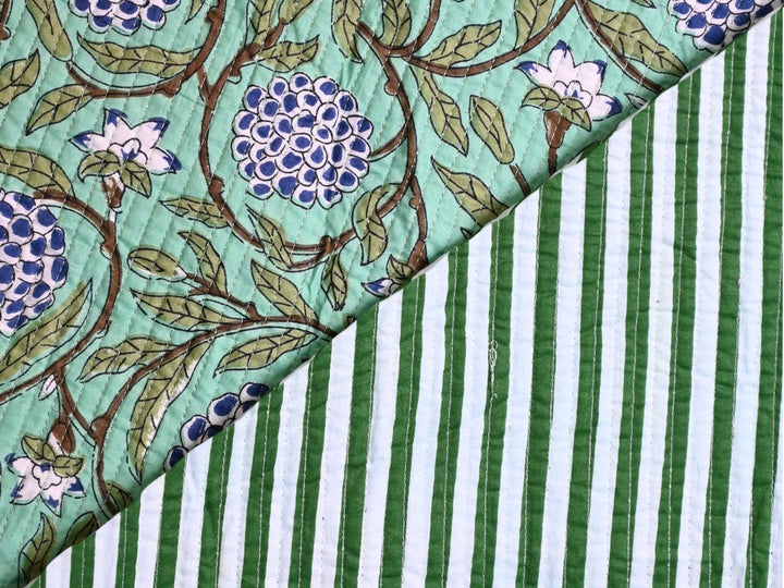Indolibas floral cotton quilted fabric with green leaves and blue flowers