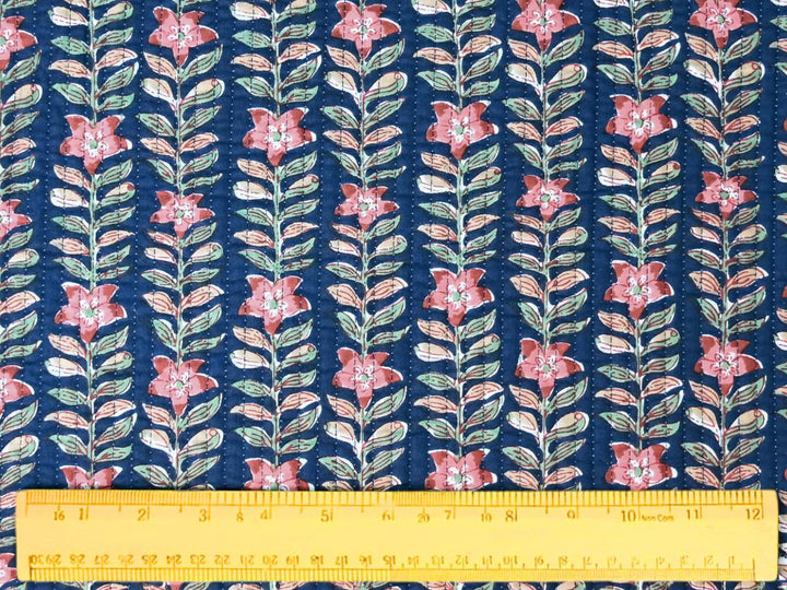 Navy floral quilting fabric with pink flowers and peach accents