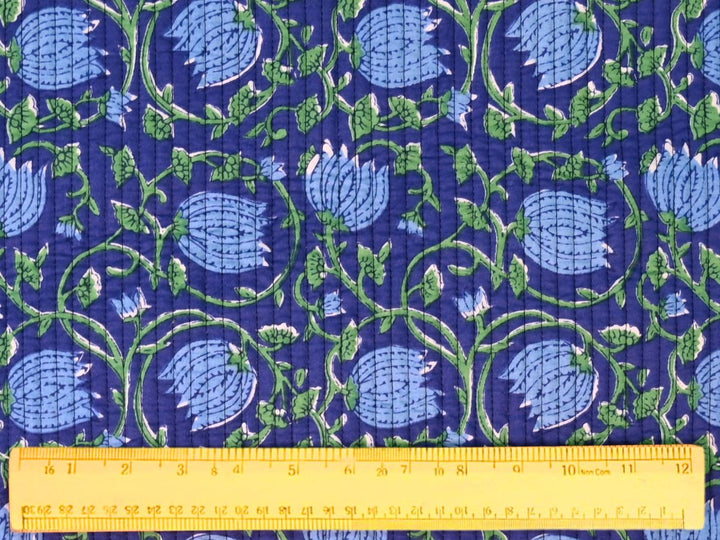 Quilted cotton fabric with traditional floral block print design