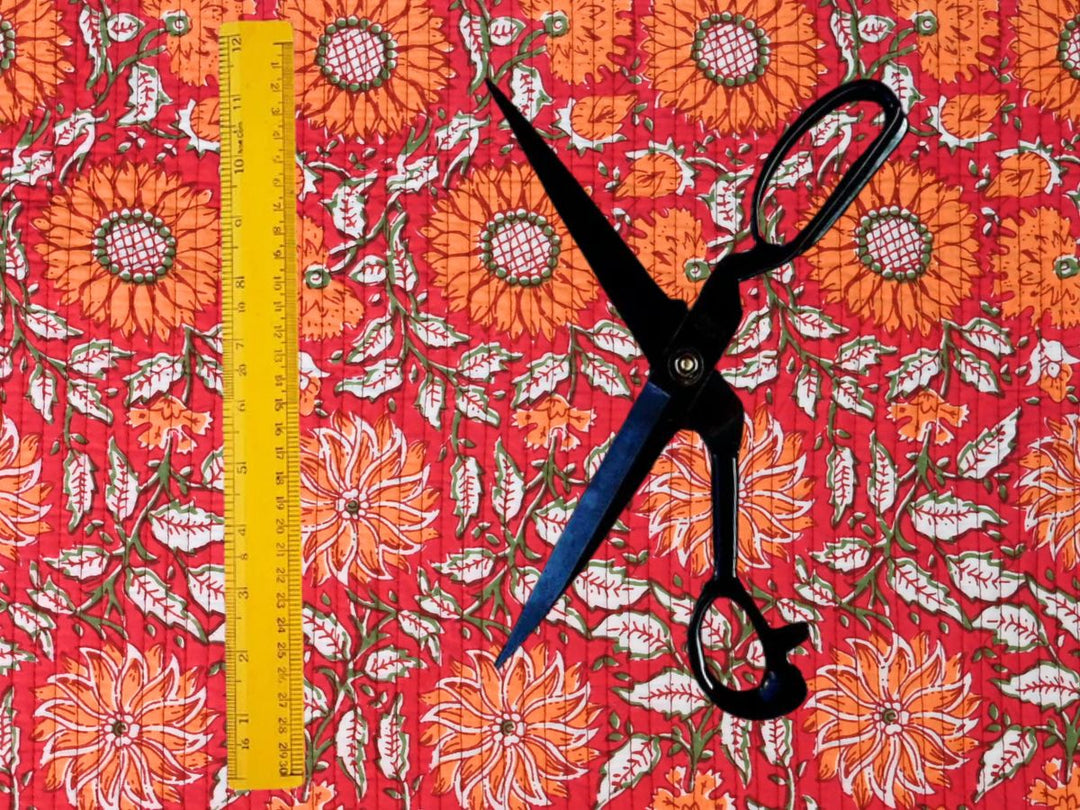 Indian-inspired woodblock quilt fabric with red and orange floral design