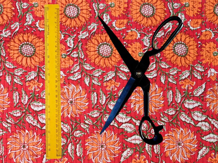 Indian-inspired woodblock quilt fabric with red and orange floral design
