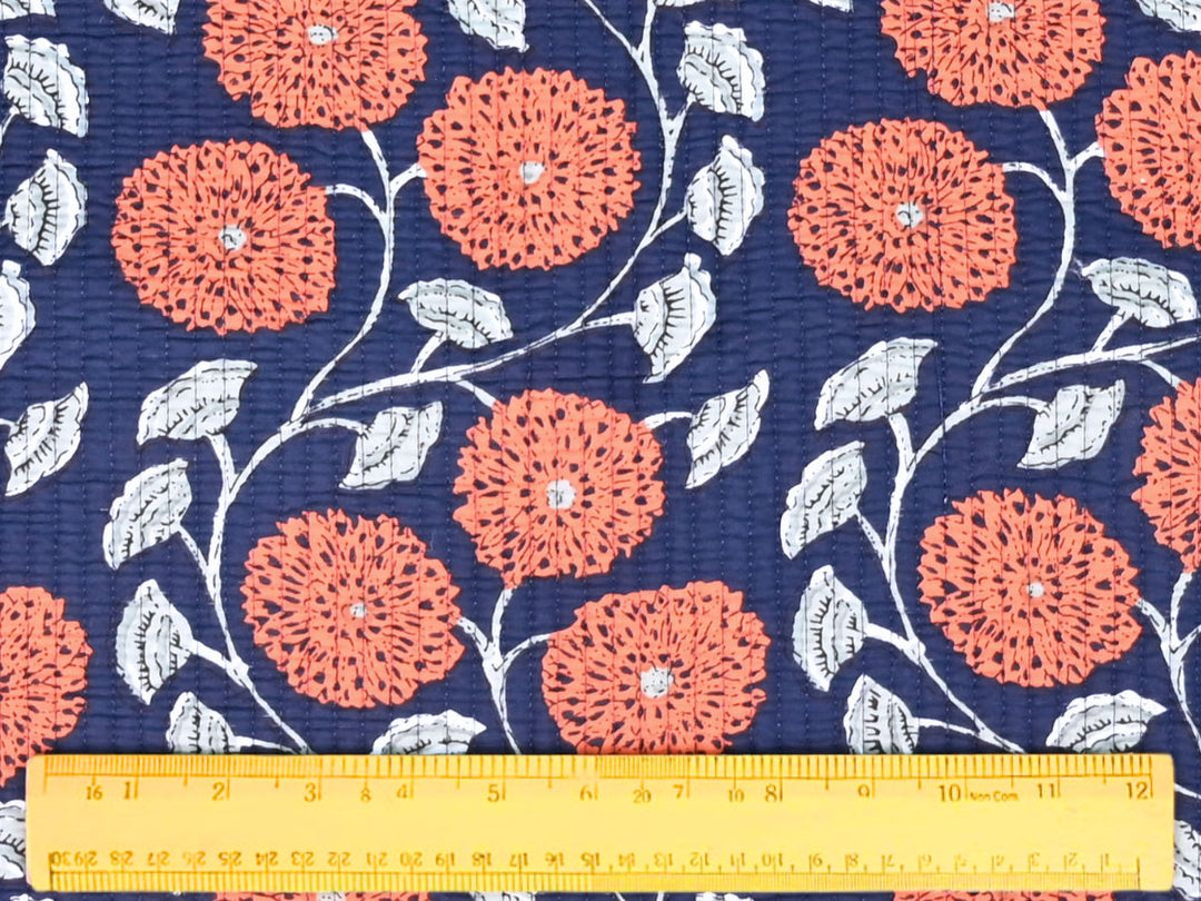 Reversible quilted fabric showing navy and white striped reverse side