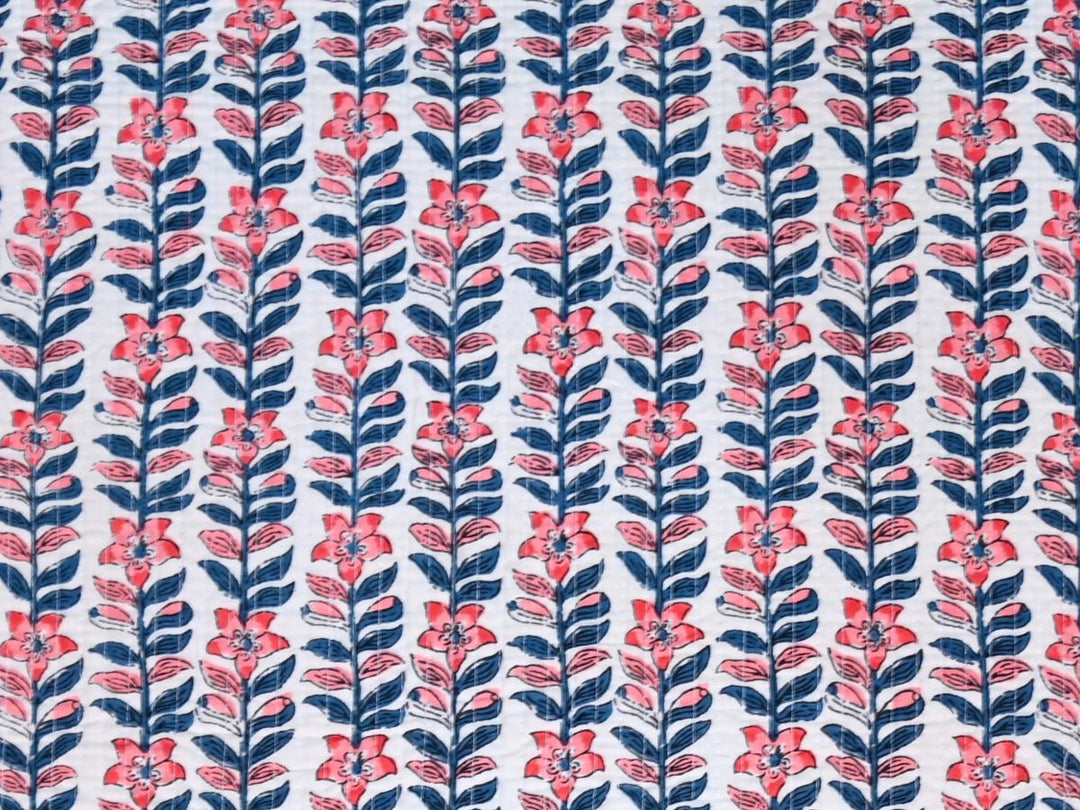 Quilted upholstery fabric by the yard with coral and navy floral stripe