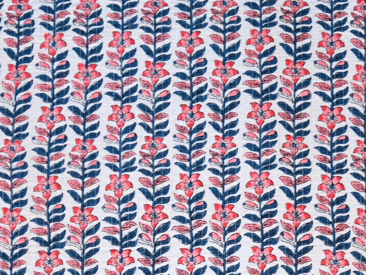 Quilted upholstery fabric by the yard with coral and navy floral stripe