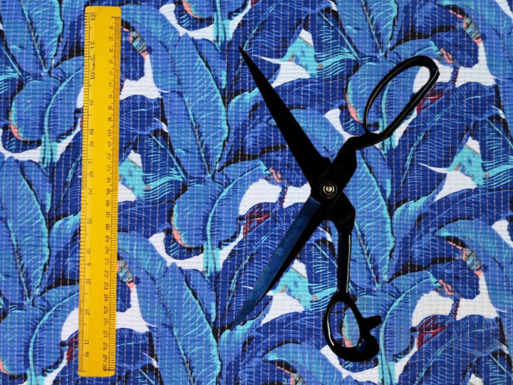 Reversible quilted fabric with blue and white striped reverse side