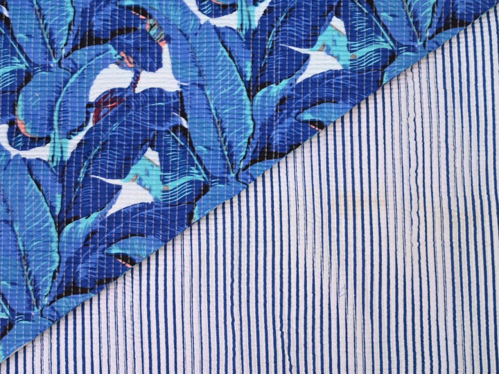 400 GSM quilted cotton fabric by the yard with blue tropical leaf print
