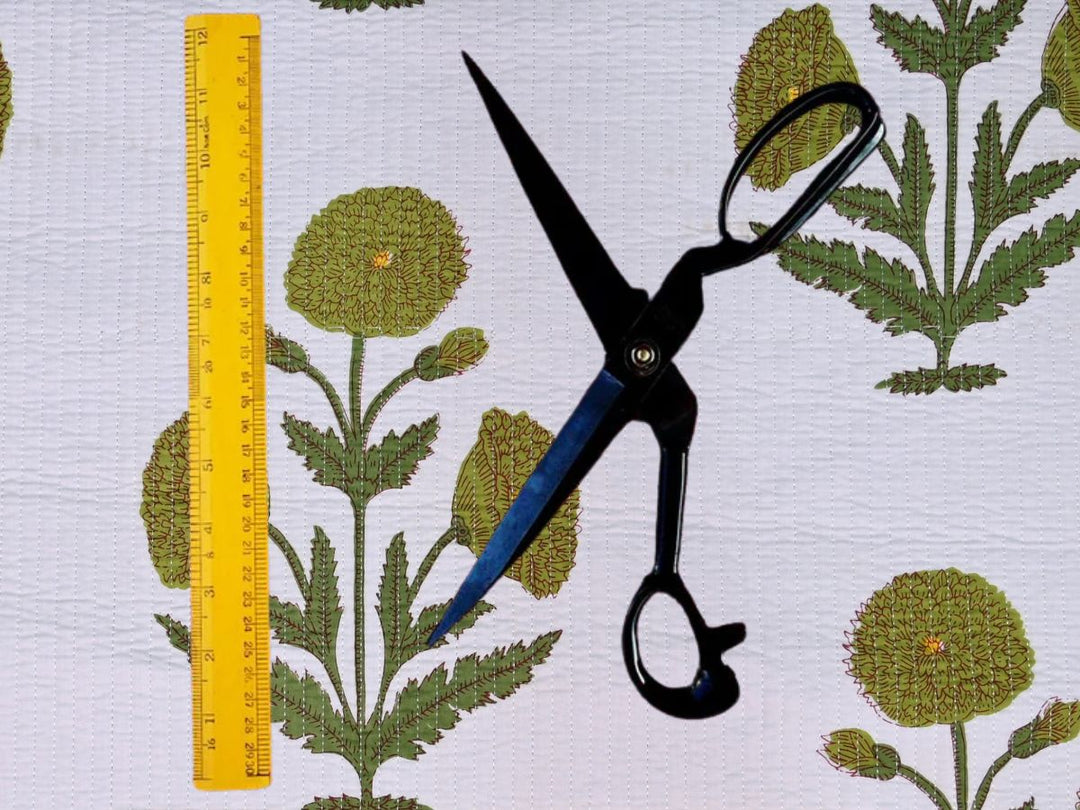 Green floral quilted fabric fat quarters showing stitch lines and yellow flower centers