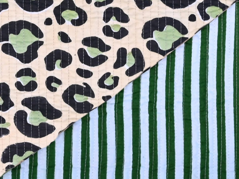 Cotton fabric for bags by the yard with green leopard print on cream
