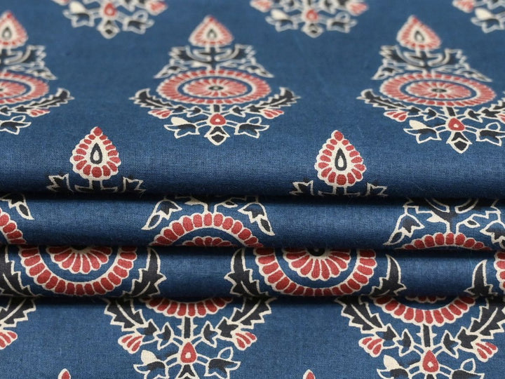 Close-up of indigo block print fabric showing rose and white floral motifs