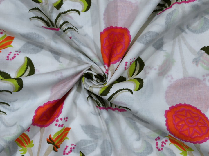 Traditional block printed fabric showing yellow bird and red floral pattern