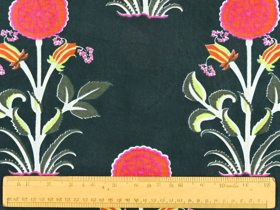 Green and pink floral print fabric showing white stems and leaf details