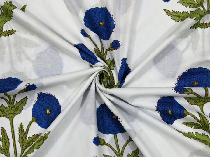 Traditional block printed fabric with repeating blue poppy floral pattern