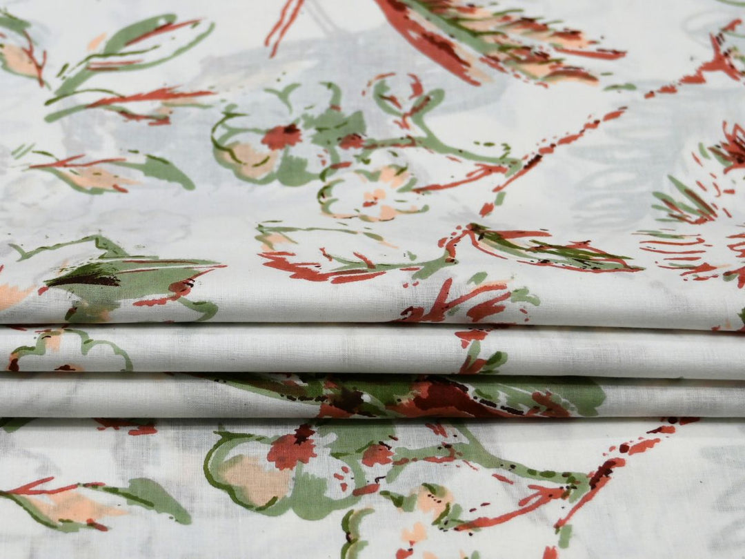 Close-up of botanical floral cotton fabric with peach and sage details