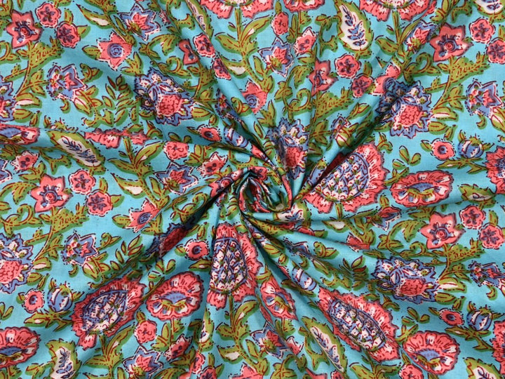 Sky blue floral Indian block print cotton fabric with green and teal accents