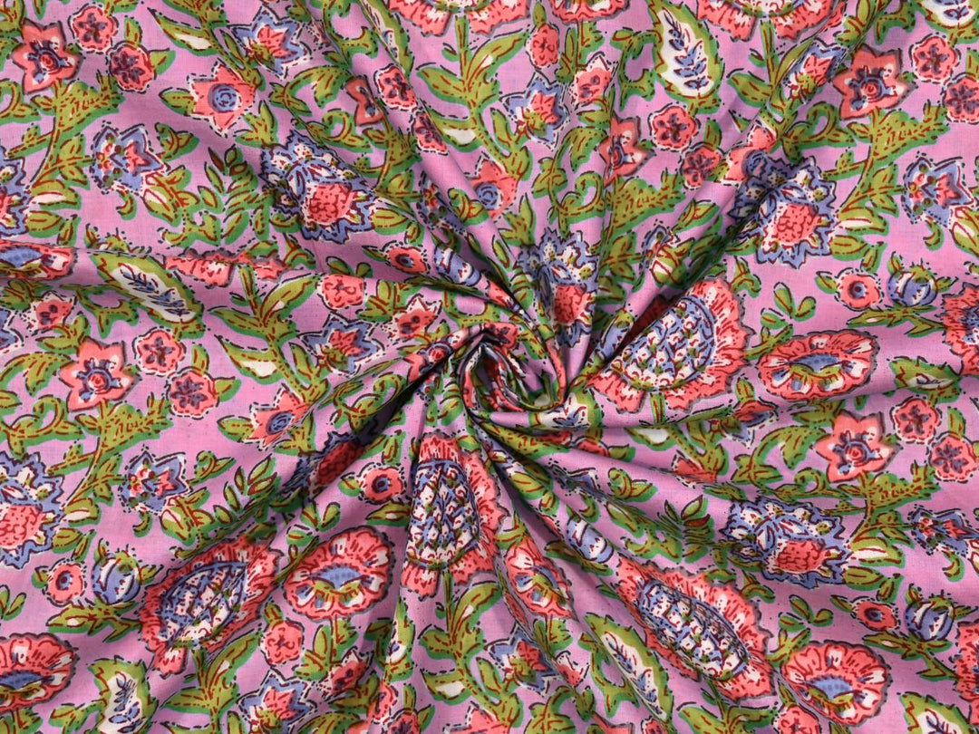 Block print quilting fabric by the yard with green ground and pink florals