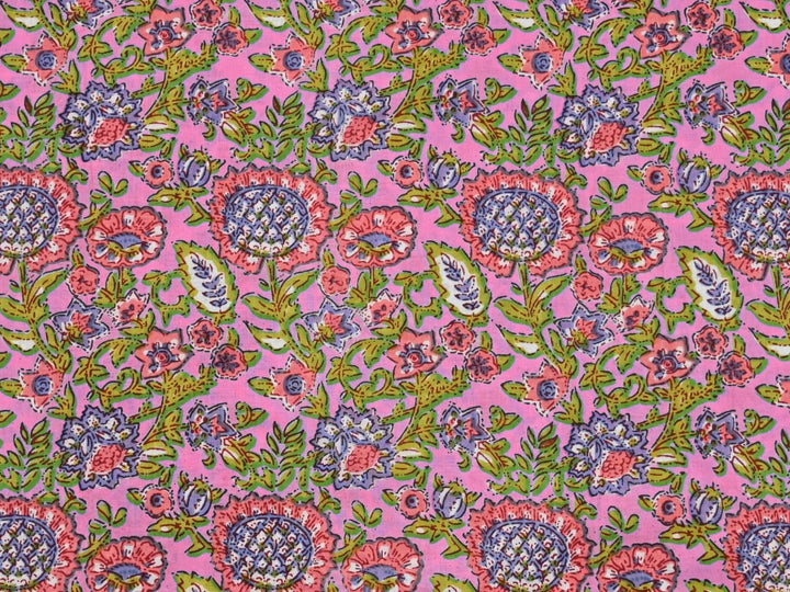 Green floral Indian block print cotton fabric with blue and purple foliage