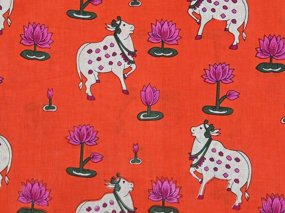 Indian fabric by the yard with orange Pichwai cow and lotus print