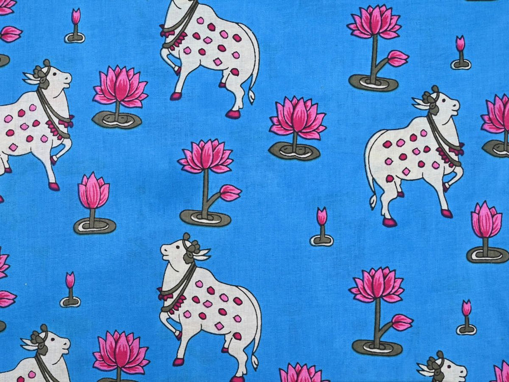 Animal print cotton fabric by the yard with blue Pichwai cow and lotus design