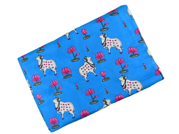 Printed cotton fabric with folk art cow and lotus animal print on cobalt blue