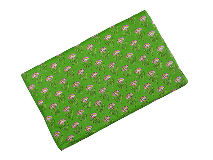 Small floral repeat block print fabric with green leafy stems on green