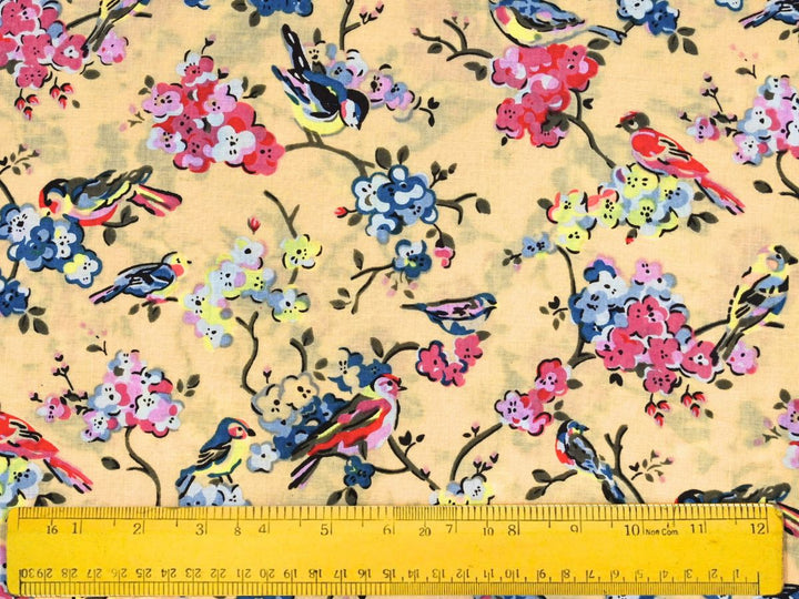 Printed cotton fabric with folk-art bird and blossom pattern on yellow