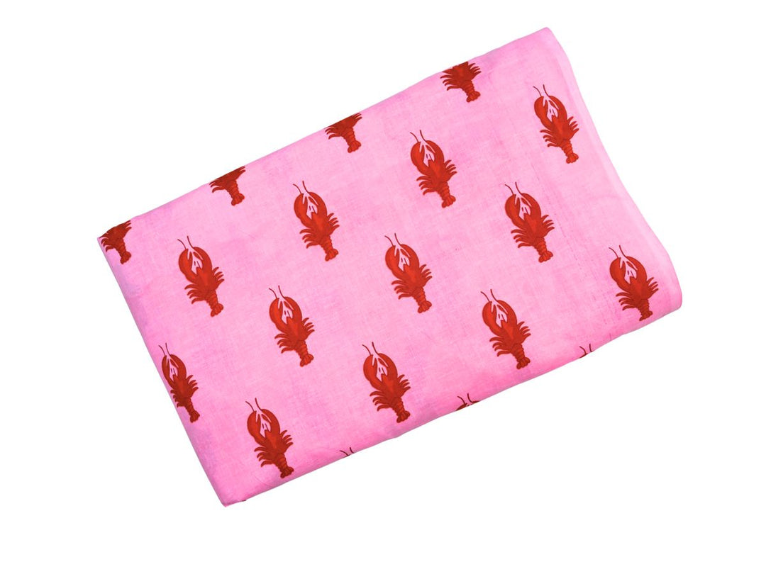 Printed cotton fabric with repeating lobster pattern on pink ground