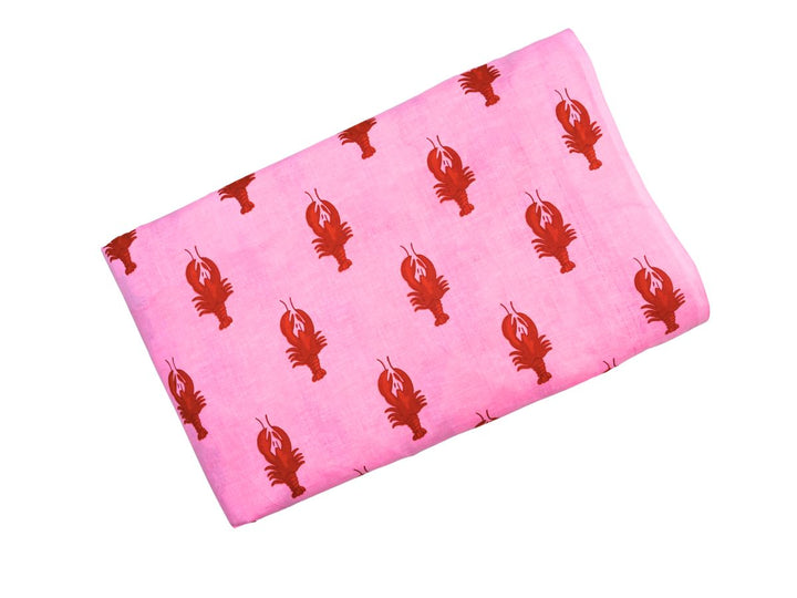 Printed cotton fabric with repeating lobster pattern on pink ground