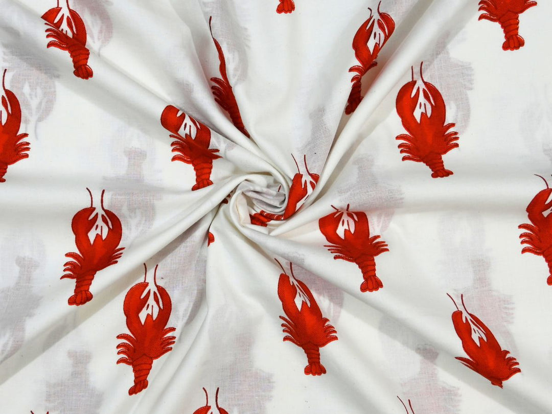 White cotton fabric showing red-orange lobster novelty motif