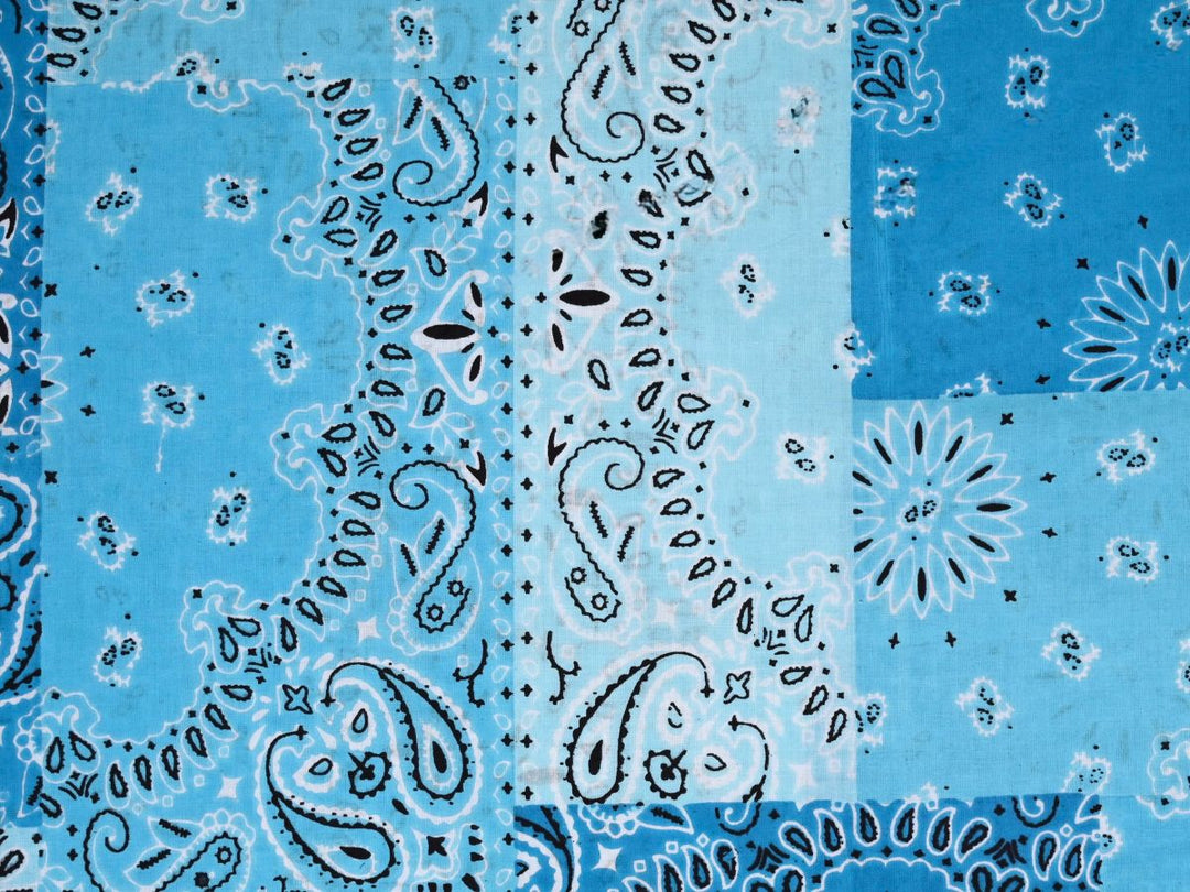 Close-up of blue bandana patchwork fabric with dotted border details