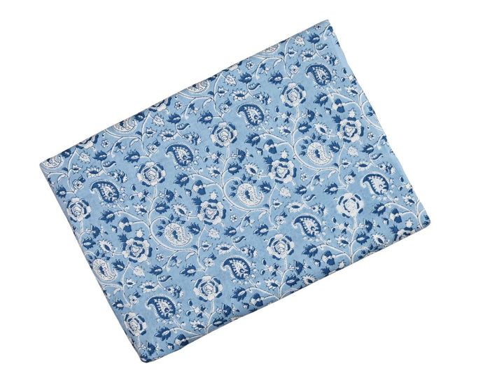 Traditional paisley and floral block print fabric on light blue ground