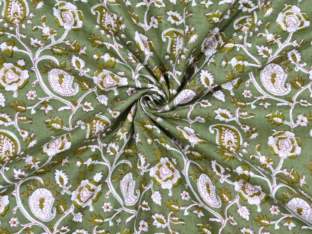 Olive green paisley block print cotton fabric with white and pink motifs