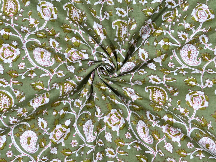 Olive green paisley block print cotton fabric with white and pink motifs