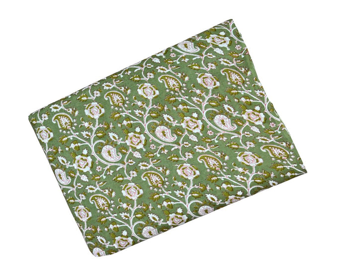 Traditional paisley and floral block print fabric on olive green ground