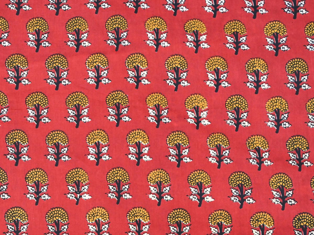 Close-up of Bagru print cotton fabric with white leaf details and dark stems