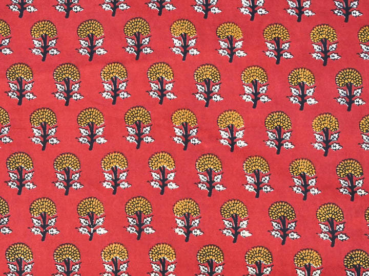 Close-up of Bagru print cotton fabric with white leaf details and dark stems